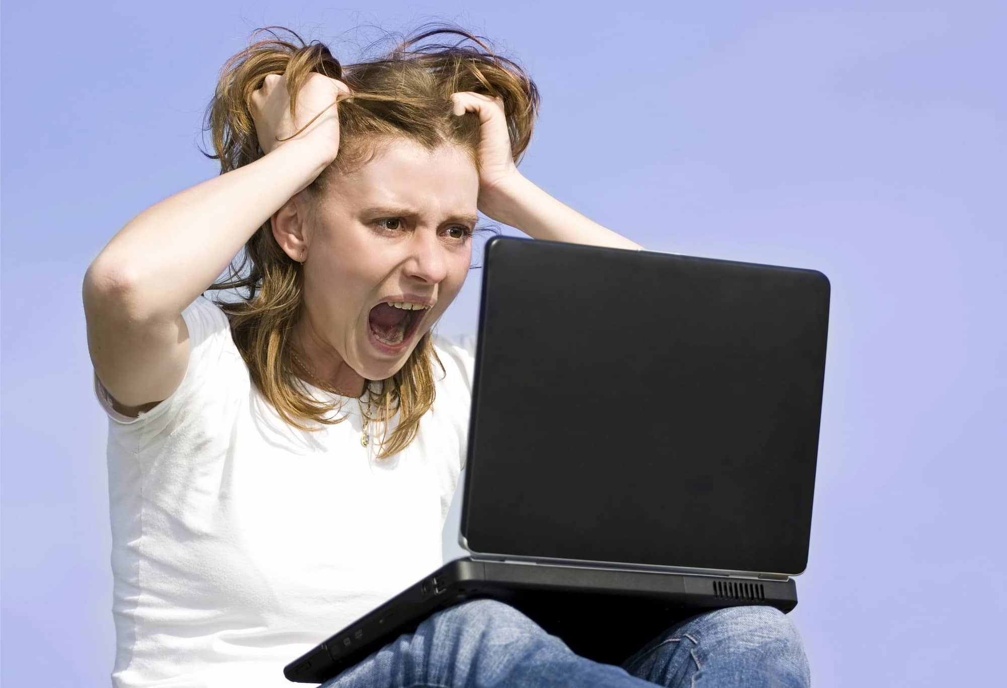 Angry woman at laptop